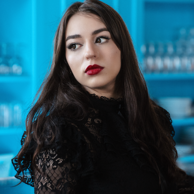 Goth girl, with red lips on blue background